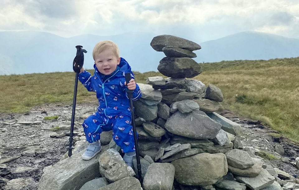 A baby was on top of the world as he tottered around a mountain summit. Little Joel Russell, 18 months, was carried up the top of Beinn Dubh, near Helensburgh, Argyll and Bute, by his dad, Kyle, 27. The tot, who has been walking since he was a year old, was given walking poles which Kyle made small enough for him to use. Dad-of-two Kyle said: "He was saying 'where are we going, where are we going?'."