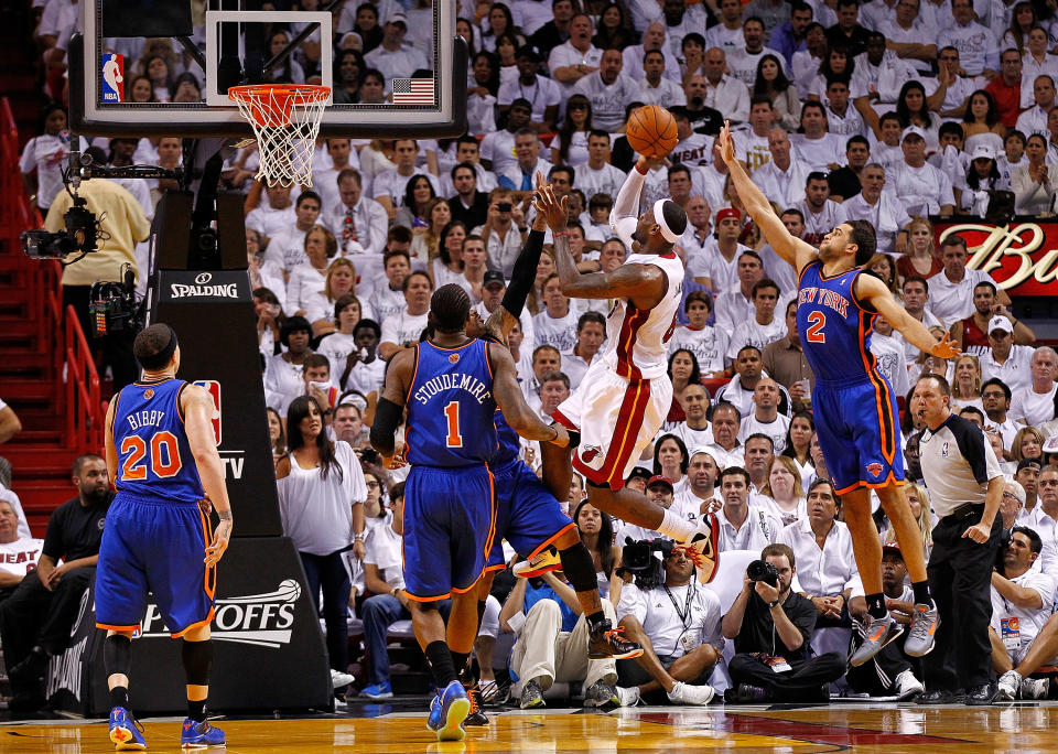 MIAMI, FL - APRIL 30: LeBron James #6 of the Miami Heat shoots over Carmelo Anthony #7 of the New York Knicks during Game Two of the Eastern Conference Quarterfinals in the 2012 NBA Playoffs at American Airlines Arena on April 30, 2012 in Miami, Florida. NOTE TO USER: User expressly acknowledges and agrees that, by downloading and/or using this Photograph, User is consenting to the terms and conditions of the Getty Images License Agreement. (Photo by Mike Ehrmann/Getty Images)