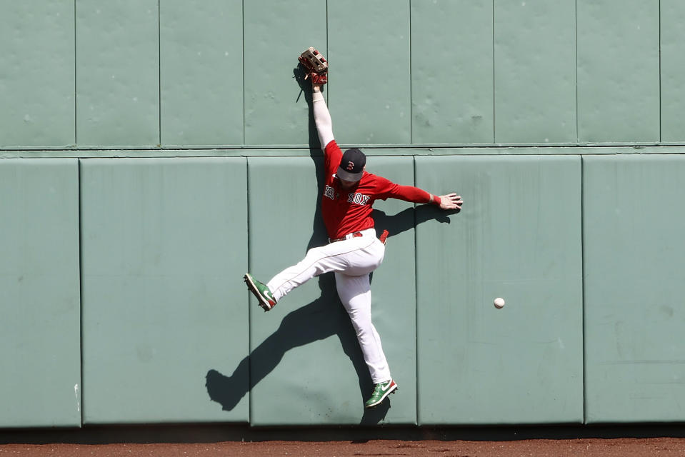 Boston Red Sox's Alex Verdugo cannot get to a triple by Tampa Bay Rays' Wander Franco during the first inning of a baseball game Monday, Sept. 6, 2021, at Fenway Park in Boston. (AP Photo/Winslow Townson)