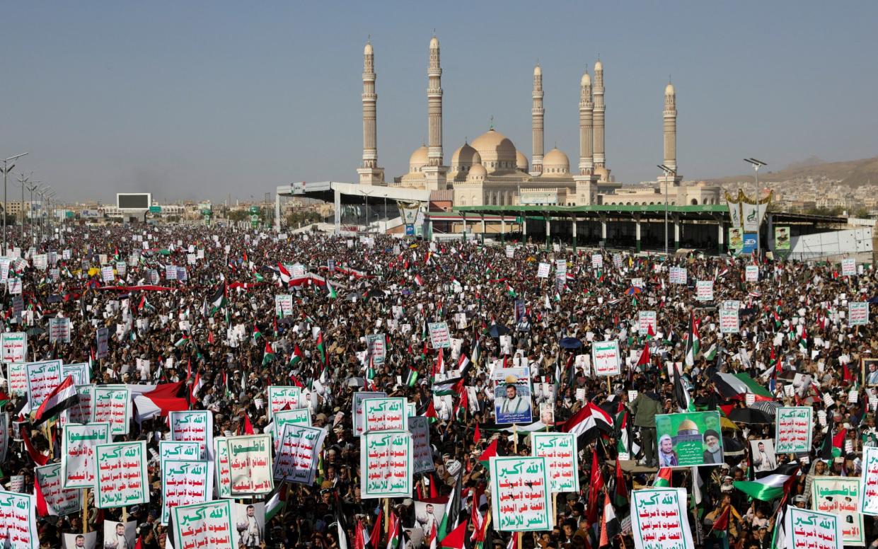 Supporters of the Houthi movement rally to denounce air strikes launched by the US and Britain on Houthi targets, in Sanaa, Yemen