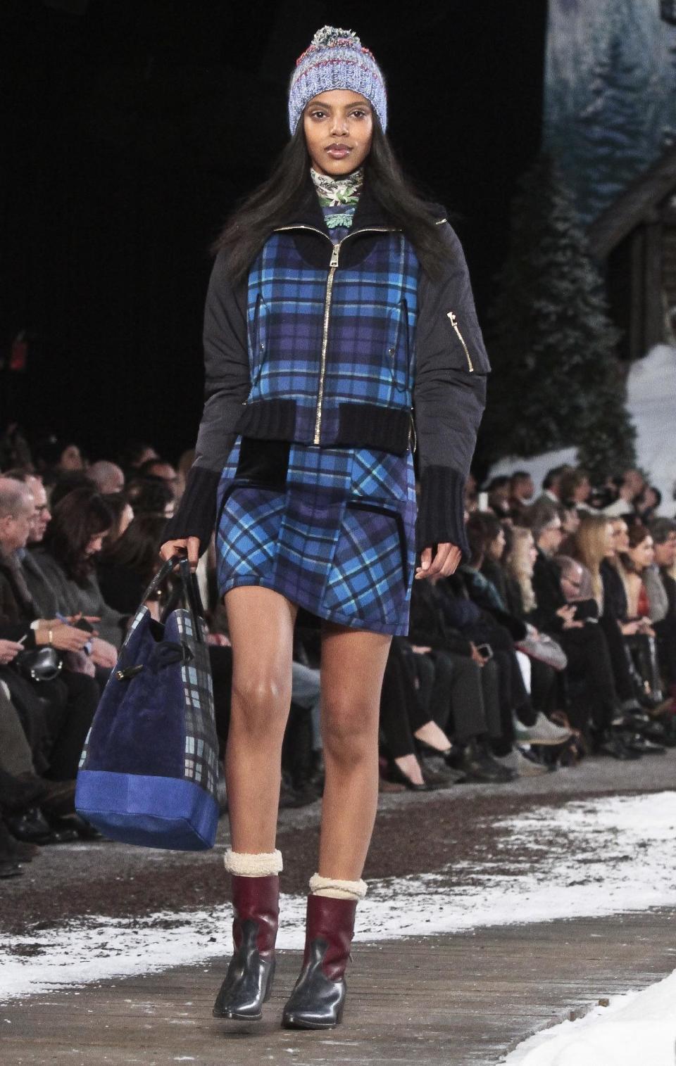 Fashion from the Tommy Hilfiger Fall 2014 collection is modeled during New York Fashion Week on Monday Feb. 10, 2014. (AP Photo/Bebeto Matthews)
