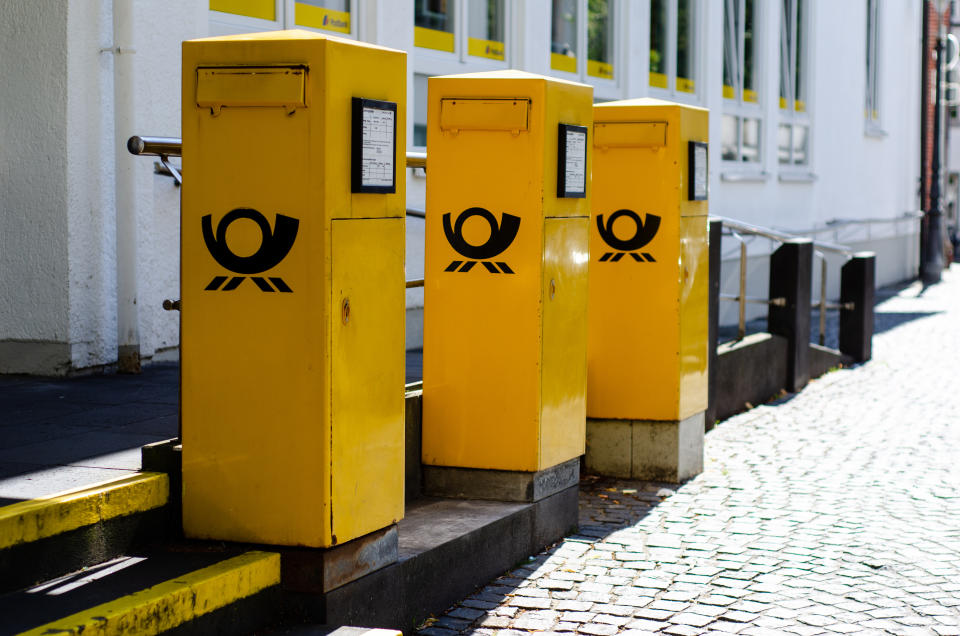 Soest, Germany - July 22, 2019: Deutsche Post Mailboxes. The Deutsche Post AG, operating under the trade name Deutsche Post DHL Group, is a German postal service and international courier service.