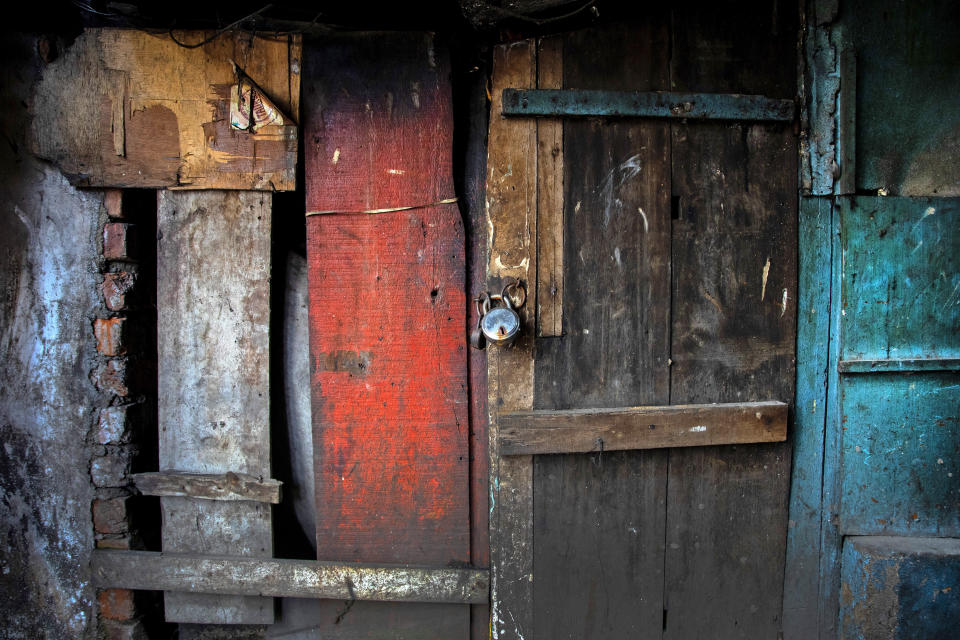 A shop is seen locked at a market area in Gauhati, India on June 18, 2021. Rows of locked shops confront bargain-hunters for most of the day in Fancy Bazar, a nearly 200-year-old market that offered cheap prices until the COVID-19 pandemic hit Gauhati, the biggest city in India’s remote northeast. (AP Photo/Anupam Nath)