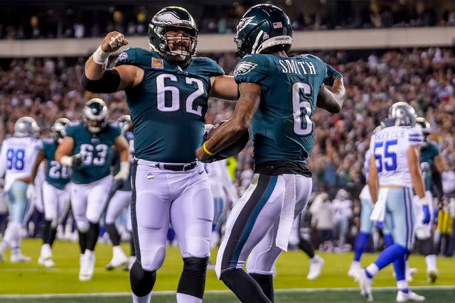 <p>AP</p> Jason Kelce and DeVonta Smith