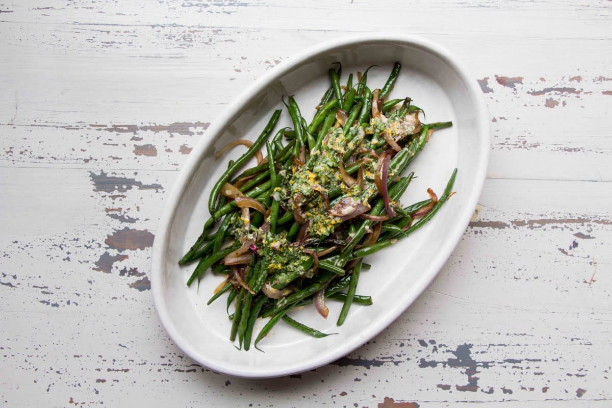 <p>Courtesy of Katie Workman</p><p>Haricot verts are slender French green beans, a bit more tender than their standard green bean cousins. The added medley of shallots and red onions makes these a step up from plain green beans. You can add a simple tangy citrusy dressing after they are cooked, and some feta, or leave them as is—up to you.</p><p><strong>Get the recipe: </strong><strong><a href="https://themom100.com/recipe/sauteed-haricot-verts-with-red-onions-and-shallots/" rel="nofollow noopener" target="_blank" data-ylk="slk:Sautéed Haricot Verts with Red Onions and Shallots;elm:context_link;itc:0;sec:content-canvas" class="link rapid-noclick-resp">Sautéed Haricot Verts with Red Onions and Shallots</a></strong></p>