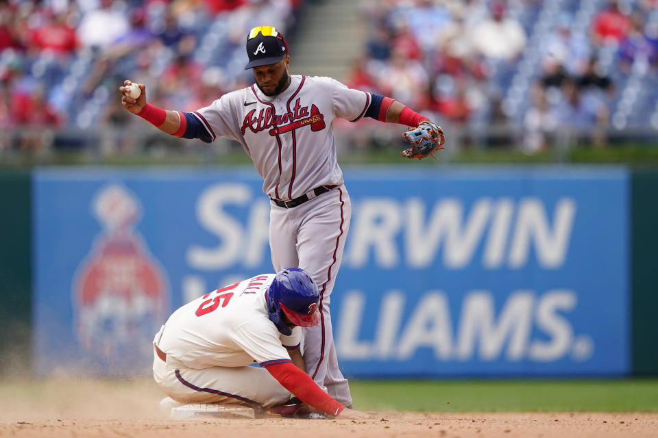 Philadelphia Phillies' Darick Hall, left, collides with Atlanta Braves second baseman Robinson Cano after being forced out at second on a fielder's choice hit into by Nick Castellanos during the eighth inning of a baseball game, Wednesday, July 27, 2022, in Philadelphia. Castellanos was safe at first on the play. (AP Photo/Matt Slocum)