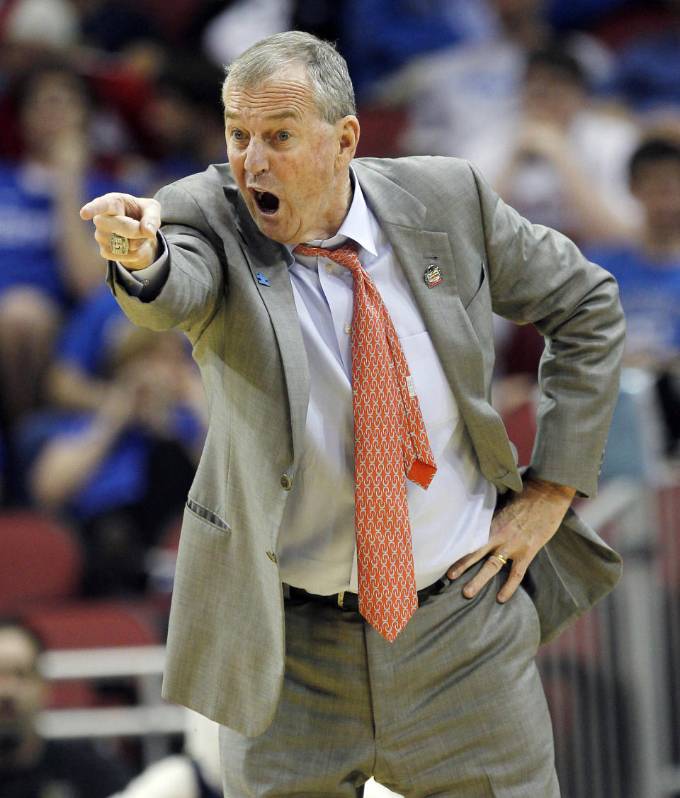 FILE - Connecticut head coach Jim Calhoun instructs his team in the first half of their NCAA tournament second-round college basketball game against Iowa State in Louisville, Ky., Thursday, March 15, 2012. Roy Williams and Jim Calhoun will join John Beilein and Lon Kruger in a star-studded cast of coaches who will be inducted into the National College Basketball Hall of Fame in November.(AP Photo/Dave Martin, File)