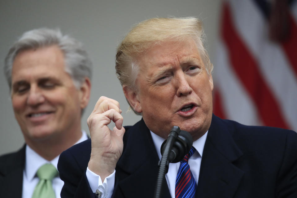 President Donald Trump joined by House Minority Leader Kevin McCarthy of Calif., and other Congressional Republican leaders, gestures like he is talking on a phone during a news conference in the Rose Garden of the White House in Washington, after a meeting with Congressional leaders on border security, as the government shutdown continues Friday, Jan. 4, 2019. (AP Photo/Manuel Balce Ceneta)