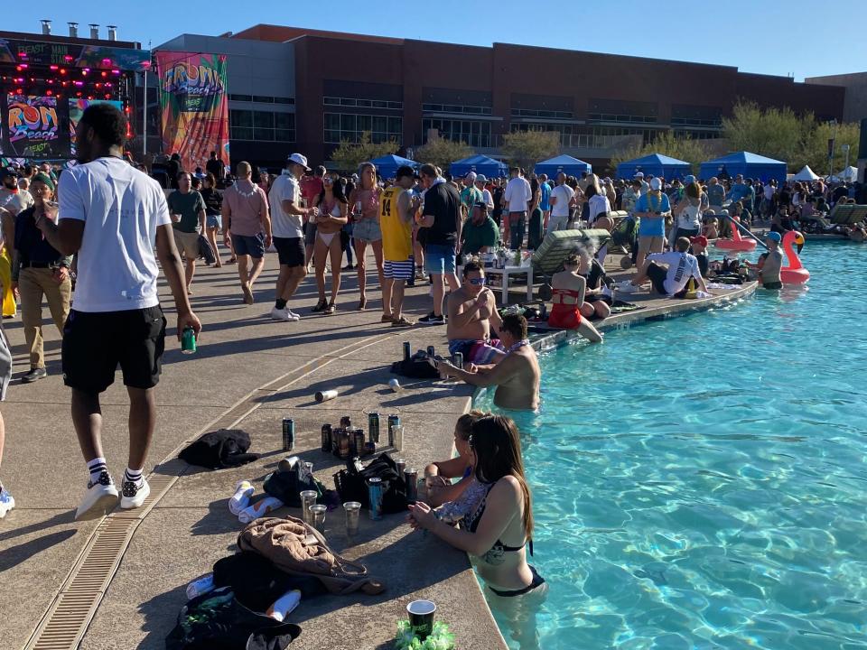Fans chill in the pool at Gronk Beach.