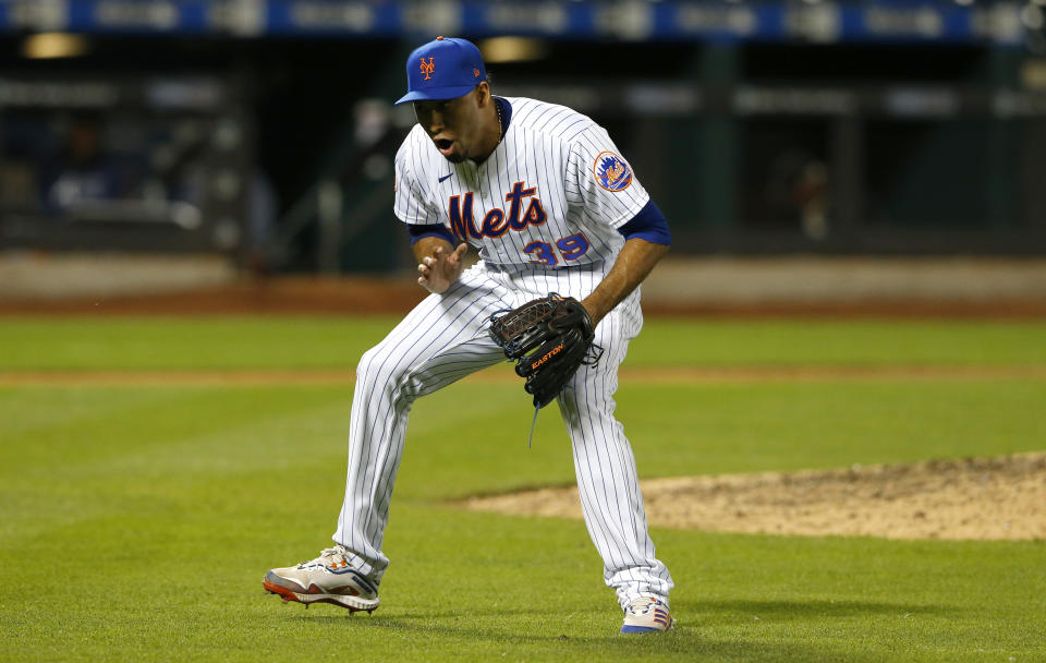 New York Mets relief pitcher Edwin Diaz (39) reacts after the final out against the Atlanta Braves during the ninth inning of a baseball game. Wednesday, June 23, 2021, in New York. (AP Photo/Noah K. Murray)