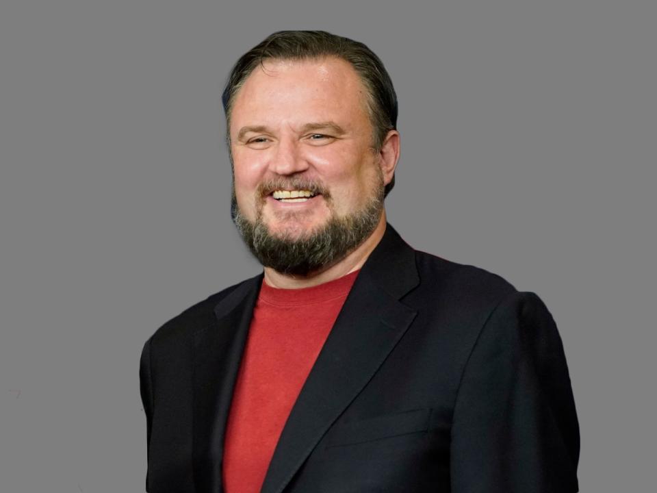 Daryl Morey headshot, as Houston Rockets General Manager, graphic element on gray 