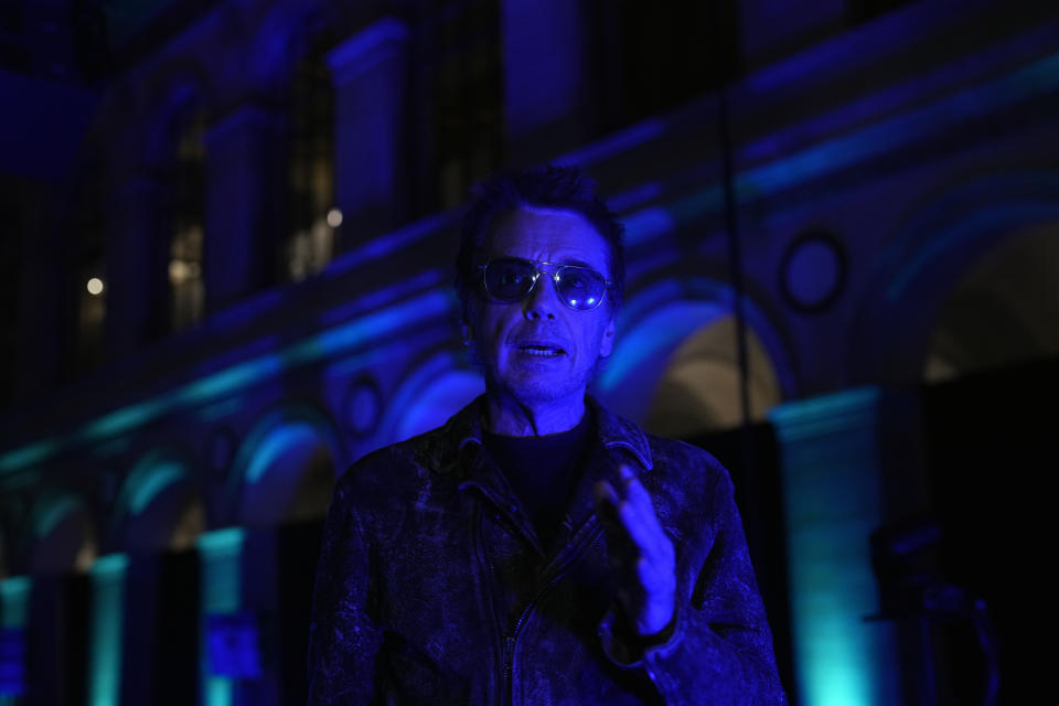 French electronic music performer Jean-Michel Jarre gestures during an interview with Associated Press, in Paris, Tuesday, Oct. 25, 2022. Genes — and a dash of humility — are the secrets of longevity for one of France's biggest music stars, Jean-Michel Jarre, the septuagenarian electronic music pioneer who's sold over 85 million records and is still going strong. (AP Photo/Thibault Camus)