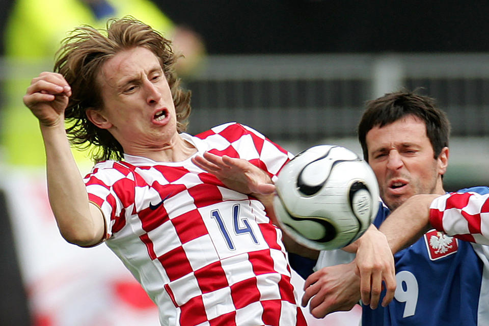 FILE - Croatia's Luka Modric, left, and Poland's Maciej Zurawski challenge for the ball during a friendly soccer match between Poland and Croatia as a preparation for the upcoming soccer World Cup in Wolfsburg, northern Germany, Saturday, June 3, 2006. Portugal's Cristiano Ronaldo and Croatia's Modric go to Euro 2024 showing age is no boundary for soccer's modern stars. (AP Photo/Fabian Bimmer, File)