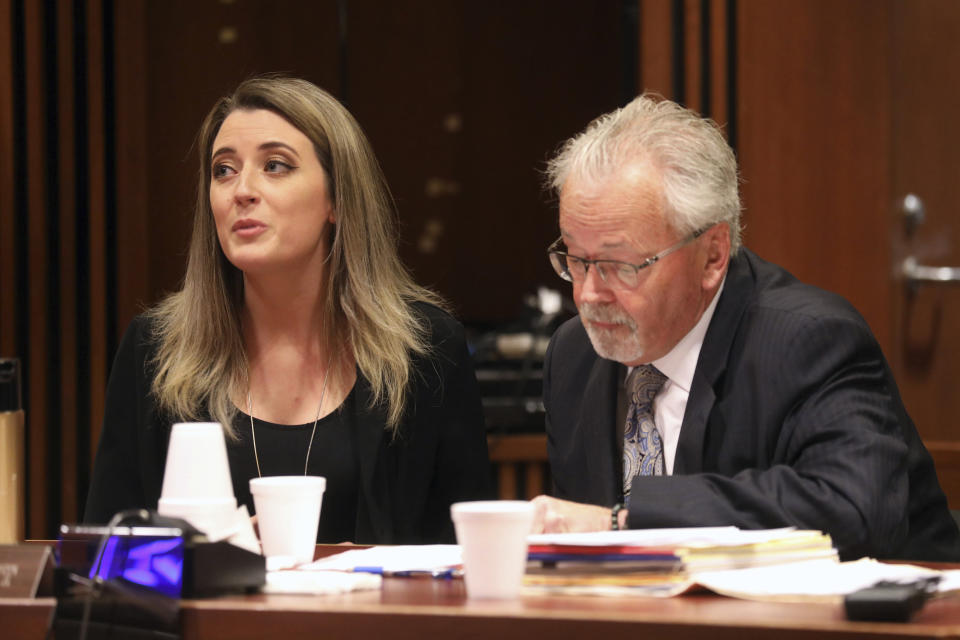 Kate McClure, 29, charged with theft by deception in the $400K GoFundMe scam, with her lawyer Jim Gerrow Jr., pleads guilty before State Superior Court Judge Christopher Garrenger in Burlington County Courthouse, Mt. Holly, N.J. Monday April 15, 2019. (David Swanson/The Philadelphia Inquirer via AP)