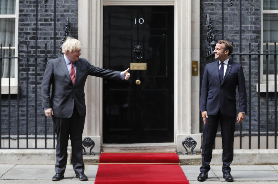 British Prime Minister Boris Johnson, left, meets with French President Emmanuel Macron at 10 Downing Street in London, Thursday, June 18, 2020. The President of the French Republic visits London to celebrate the 80th Anniversary of General de Gaulle's 'Appel' to the French population to resist the German occupation of France during WWII. (AP Photo/Frank Augstein, pool)
