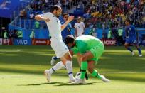 Soccer Football - World Cup - Group E - Brazil vs Costa Rica - Saint Petersburg Stadium, Saint Petersburg, Russia - June 22, 2018 Costa Rica's Marco Urena in action with Brazil's Alisson REUTERS/Carlos Garcia Rawlins