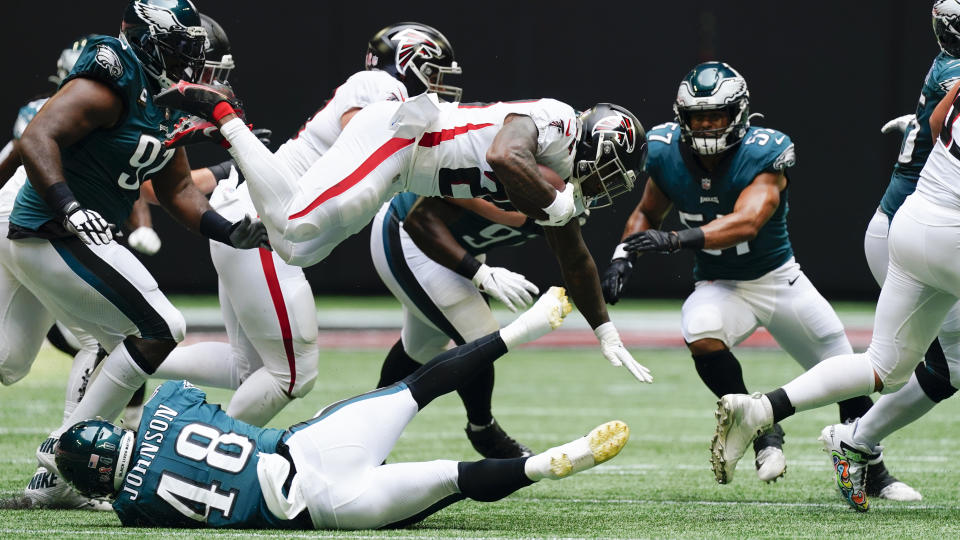 Atlanta Falcons running back Mike Davis (28) leaps in the air against the Philadelphia Eagles during the first half of an NFL football game, Sunday, Sept. 12, 2021, in Atlanta. (AP Photo/John Bazemore)
