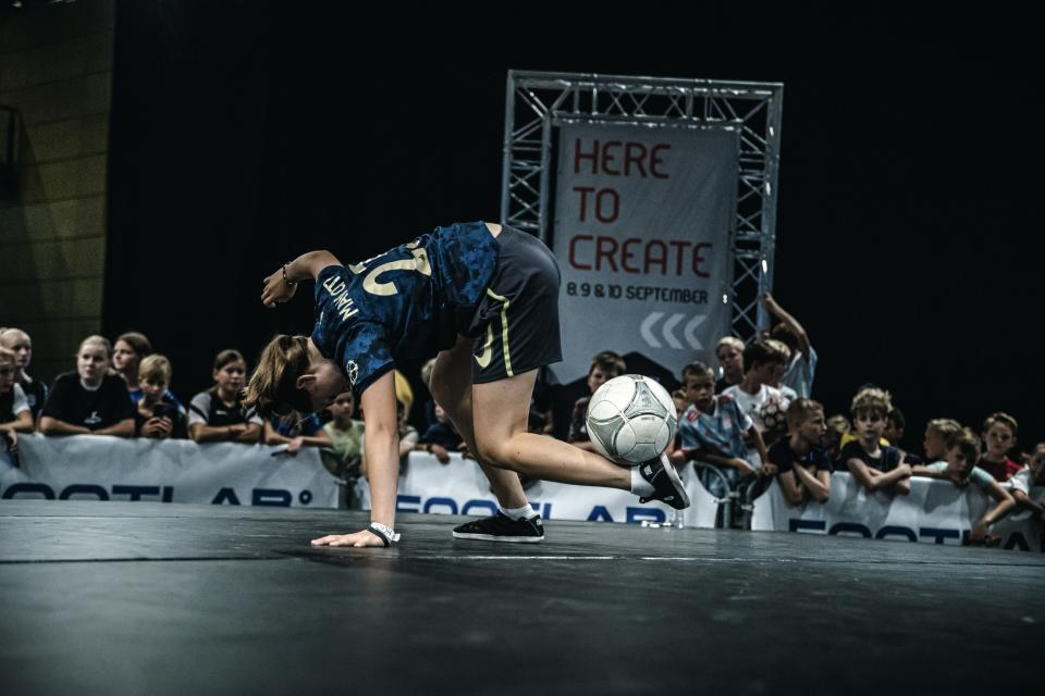 Girl kicking a ball