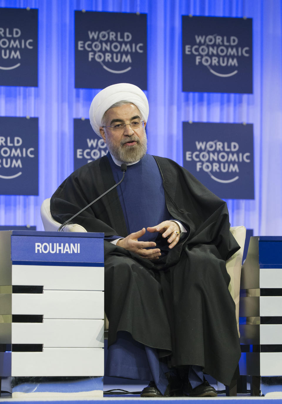 Iranian President Hassan Rouhani, gestures as speaks during a session of the World Economic Forum in Davos, Switzerland, Thursday, Jan. 23, 2014. Leaders gathered in the Swiss ski resort of Davos have made it a top priority to push to reshape the global economy and cut global warming by shifting to cleaner energy sources. (AP Photo/Michel Euler)