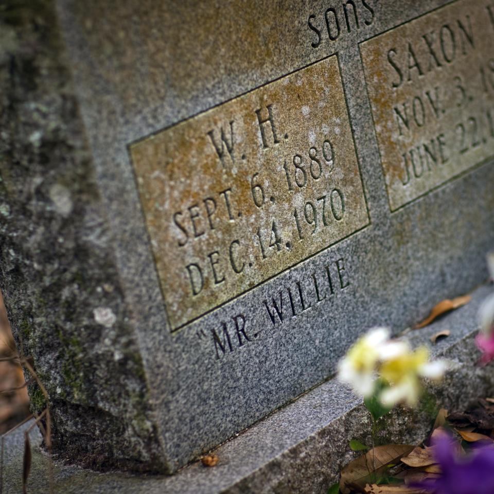 A tombstone marks the births and deaths of brothers Willie and Saxon Browne near the foundation of what was a tiny cabin on their family's land, which Willie donated to the Nature Conservancy in 1969 on the condition that it be left in its natural state.