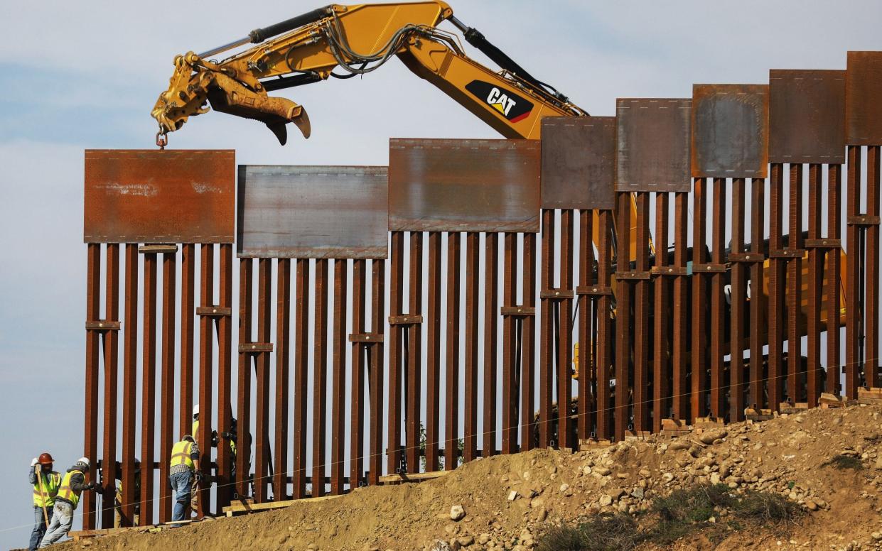 The US-Mexico border wall now be part-funded by funds earmarked for the Pentagon - Getty Images South America