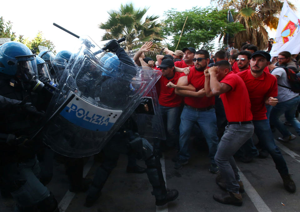 Protesters face police during the G7 summit in Giardini Naxos, Italy