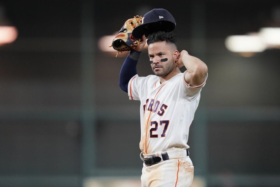 Houston Astros' Jose Altuve reacts during the eighth inning of Game 2 of the baseball World Series against the Washington Nationals Wednesday, Oct. 23, 2019, in Houston. (AP Photo/David J. Phillip)