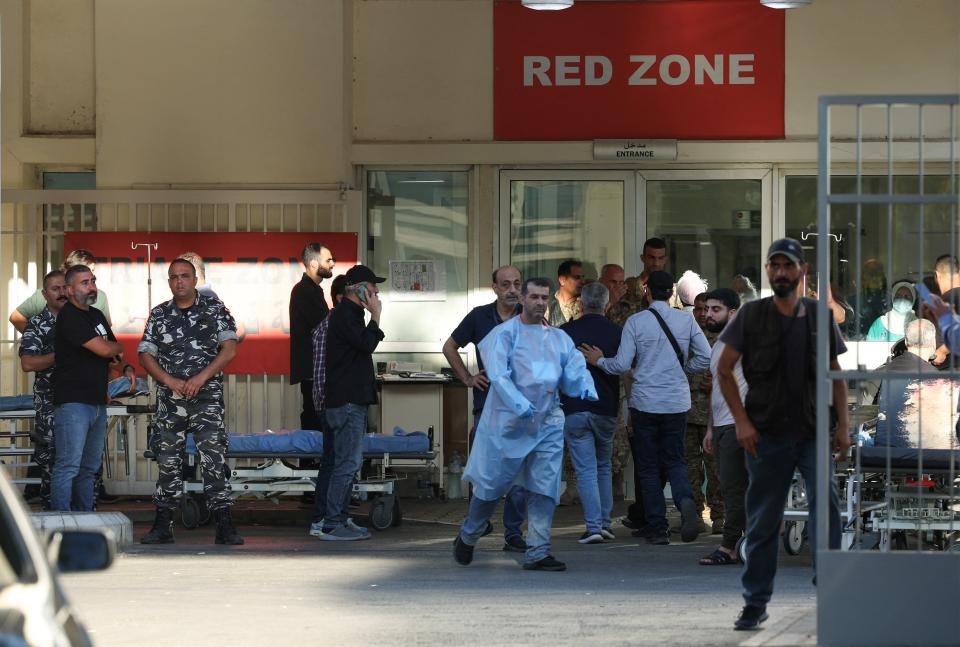 People gather outside a hospital, as several people, including Hezbollah fighters and medics, were wounded on Tuesday, 17 September 2024 in Lebanon (Reuters)