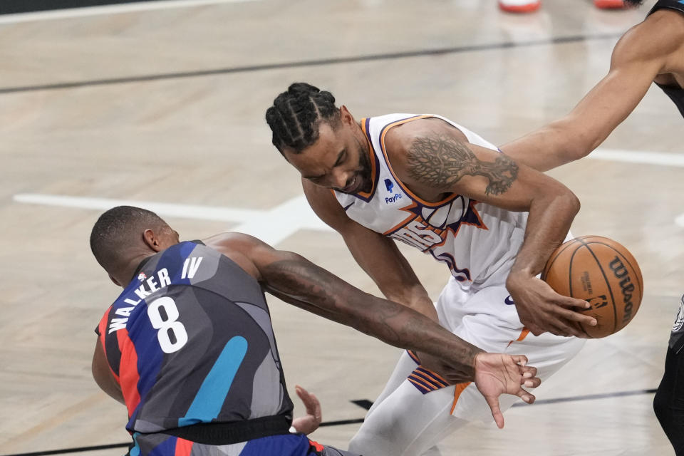 Brooklyn Nets guard Lonnie Walker IV (8) guards Phoenix Suns forward Keita Bates-Diop during the first half of an NBA basketball game, Wednesday, Jan. 31, 2024, in New York. (AP Photo/Mary Altaffer)
