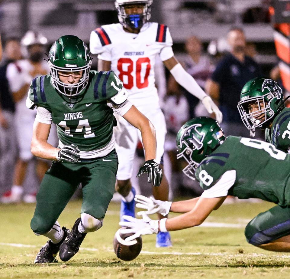 El Diamante's Colin Kane, right, recovers a Tulare Western fumble in non-league high school football on Friday, August 23, 2024.