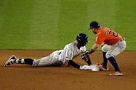 Oct 18, 2017; Bronx, NY, USA; New York Yankees shortstop Didi Gregorius (18) dives into second base for a double during the seventh inning against Houston Astros second baseman Jose Altuve (27) in game five of the 2017 ALCS playoff baseball series at Yankee Stadium. Mandatory Credit: Adam Hunger-USA TODAY Sports
