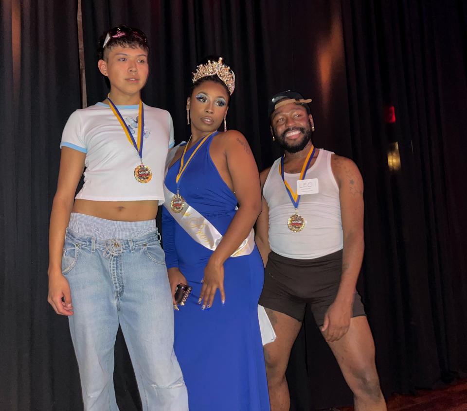 (From left) Isis, 21, Chelle Tootsie, and Leo Ahmon, 26, win grand prizes at Vogue night at Stacy's at Melrose on Aug. 4, 2022.