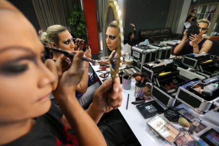 "Drag Race Thailand" contestants Thanisorn Hengsoontorn 'Annee Maywong' and Supattarapon Kasikam 'Dearis Doll' prepare before a photo shoot at a studio in Bangkok, Thailand March 23, 2018. REUTERS/Athit Perawongmetha