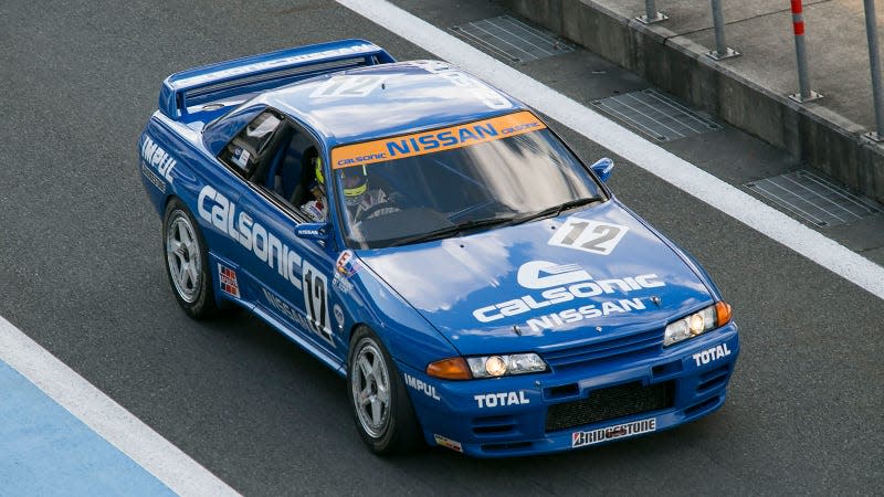 A photo of a blue Nissan Skyline GT-R R32 racing car. 