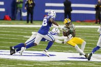 Green Bay Packers' Marquez Valdes-Scantling (83) makes a catch against Indianapolis Colts' Julian Blackmon (32) during the second half of an NFL football game, Sunday, Nov. 22, 2020, in Indianapolis. (AP Photo/Michael Conroy)