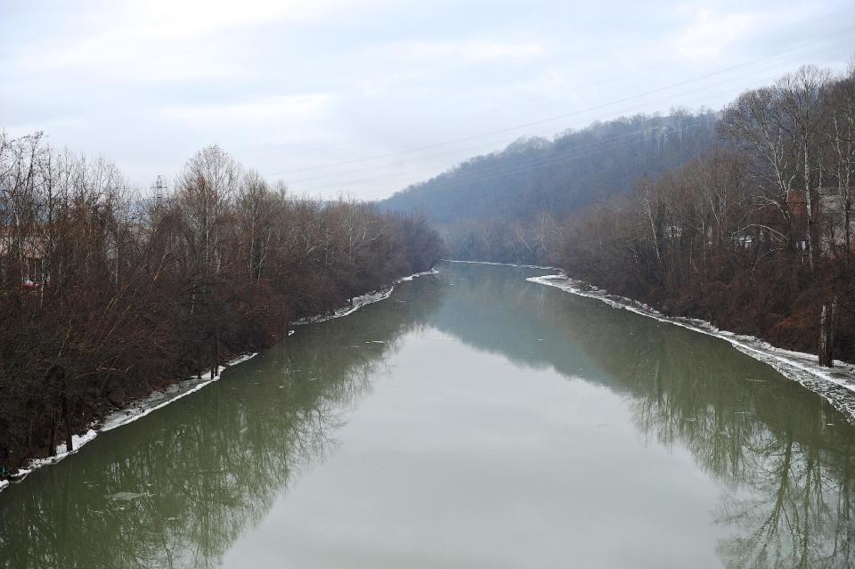 A stretch of the Elk River in Charleston, W.Va., is shown Friday, Jan. 10, 2014. The White House has issued a federal disaster declaration in West Virginia, where a chemical spill in the Elk River that may have contaminated tap water has led officials to tell at least 300,000 people not to bathe, brush their teeth or wash their clothes. The West Virginia National Guard planned to distribute bottled drinking water to emergency services agencies in the nine affected counties. About 100,000 water customers, or 300,000 people total, were affected, state officials said. (AP Photo/Tyler Evert)