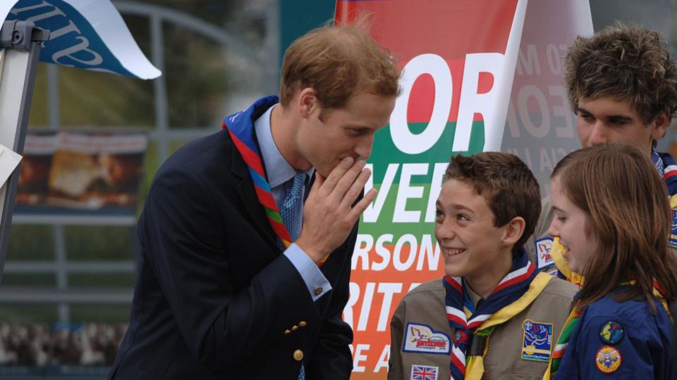 Prince William jokes with scouts at the opening of the 21st World Scout Jamboree in England