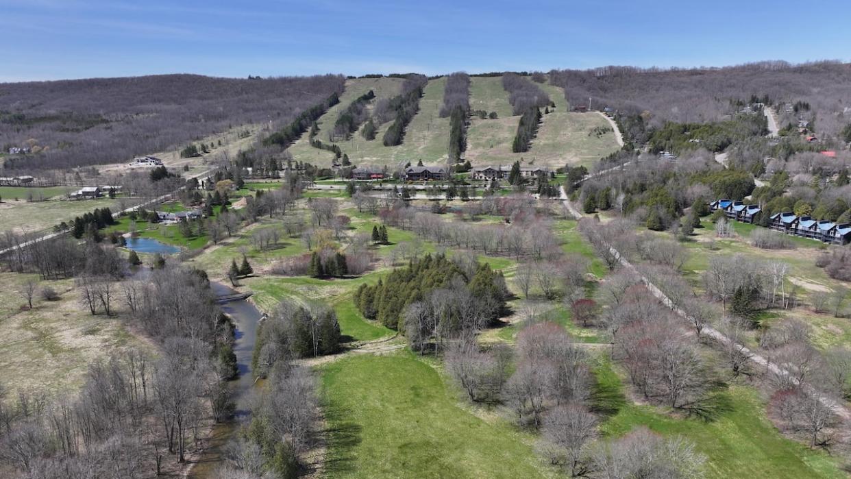 A proposal by the Beaver Valley Development Group would see up to 370 condominium and townhouse units built on land in the central section of this photo, below the former Talisman Ski Hill, near Kimberley, Ont. The property falls within the area covered by the province's Niagara Escarpment Plan.    (Patrick Morrell/CBC - image credit)