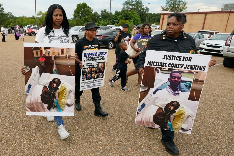 FILE – Activists march towards the Rankin County Sheriff’s Office in Brandon, Miss., Wednesday, July 5, 2023, calling for the termination and prosecution of Rankin County Sheriff Bryan Bailey for running a law enforcement department that allegedly terrorizes and brutalizes minorities. Six white former law enforcement officers in Mississippi have pleaded guilty to a racist assault on Michael Corey Jenkins and his friend Eddie Terrell Parker, who are Black. (AP Photo/Rogelio V. Solis, File)