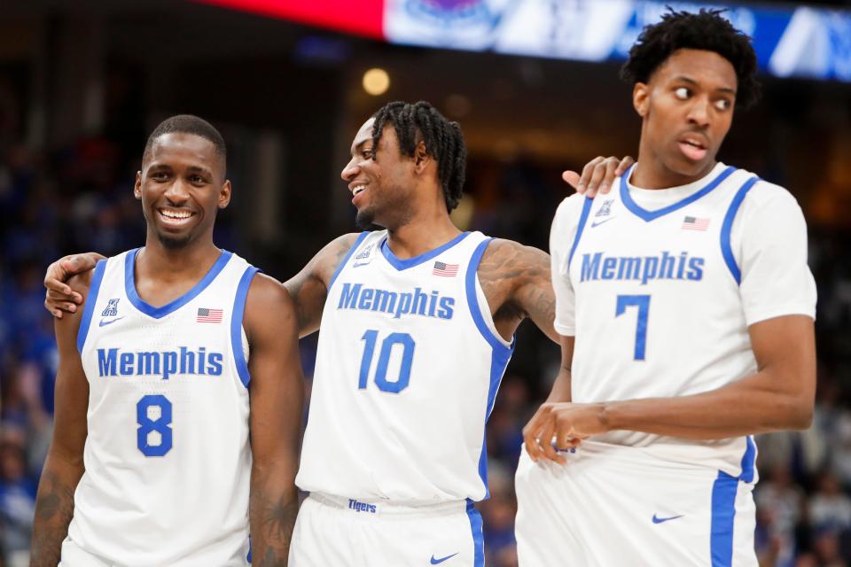 Memphis' David Jones (8), Jaykwon Walton (10) and Nae'Qwan Tomlin (7) talk to each other during the game between Florida Atlantic University and University of Memphis at FedExForum in Memphis, Tenn., on Sunday, February 25, 2024.