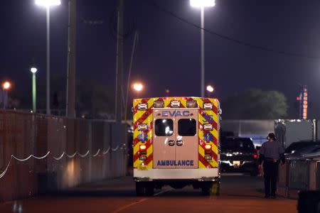 An ambulance carrying NASCAR Xfinity Series driver Kyle Busch (54) leaves the track after Alert Florida 300 at Daytona International Speedway. Mike DiNovo-USA TODAY Sports