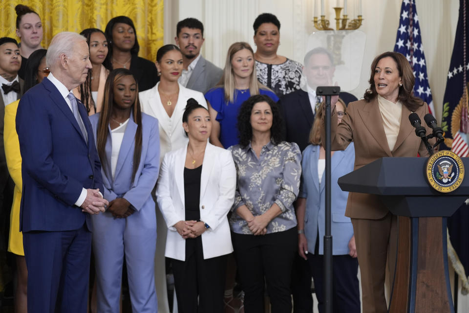 Vice President Kamala Harris speaks as President Joe Biden, left, listens during an event to celebrate the 2023 WNBA champion Las Vegas Aces, in the East Room of the White House, Thursday, May 9, 2024, in Washington. (AP Photo/Evan Vucci)
