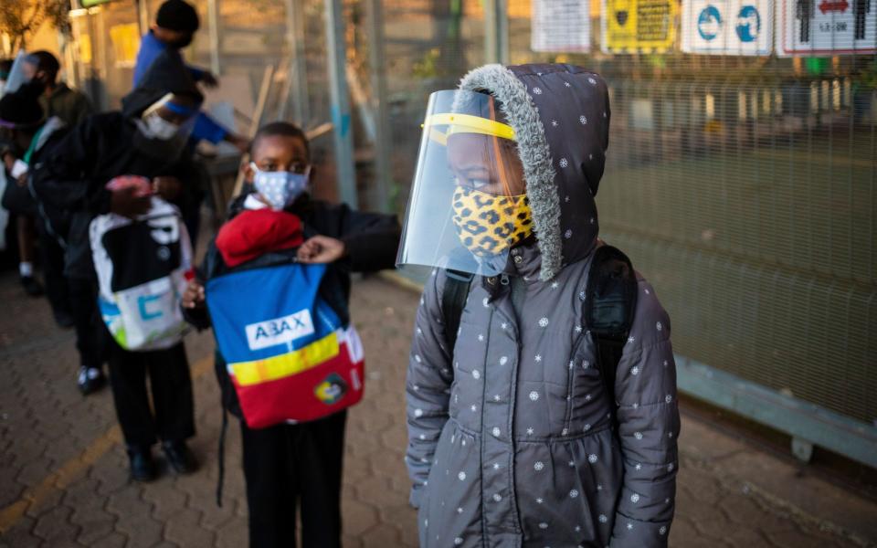 Schoolchildren attend a class in Johannesburg, South Africa, the worst affected country in Africa - Shutterstock