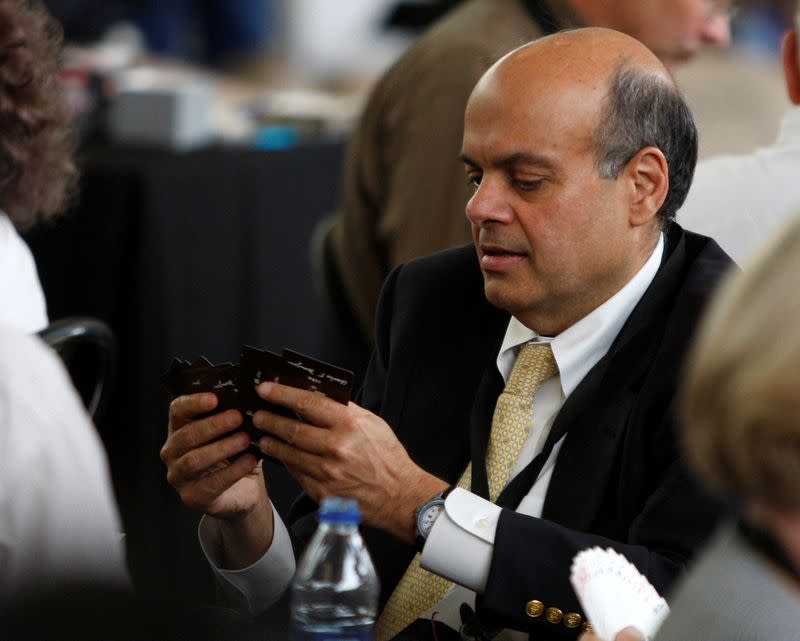FILE PHOTO: Ajit Jain of Berkshire's insurance operations plays a game of bridge during Berkshire Hathaway Shareholders annual meeting in Omaha