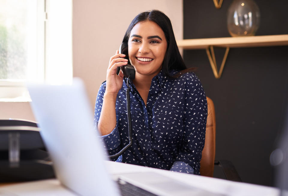 A receptionist on the phone