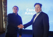 FILE - This handout photo provided by the Ministry of Communication shows Tesla and SpaceX chief executive officer Elon Musk wearing the Defense Order of Merit medal as he shakes hands with Brazil's President Jair Bolsonaro, in Porto Feliz, Brazil, May 20, 2022. Musk is the first foreign civilian without a government position to receive the Brazilian Defense Ministry honor since its creation, (Cleverson Oliveira/Ministry of Communication via AP, File)