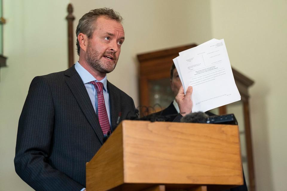 Blake Brickman, a former senior-level employee in the attorney general's office and one of the whistleblowers, speaks at a news conference in the Capitol on Sept. 25.