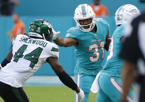 Raheem Mostert (R) and the Miami Dolphins will face the Philadelphia Eagles on Sunday in Philadelphia. File Photo by Thom Baur/UPI