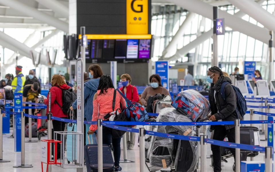 Passengers wait to check in at Heathrow as international travel resumed on Monday - Jason Alden/Bloomberg