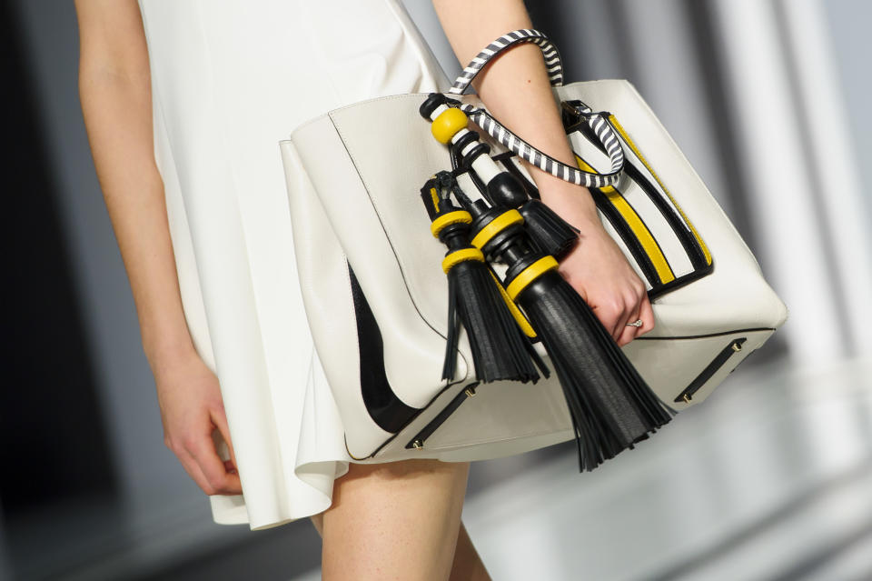 A model wears an accessory created by Anya Hindmarch during London Fashion Week Autumn/Winter 2014, in central London in central London, Tuesday, Feb. 18, 2014. (Photo by Jonathan Short/Invision/AP)